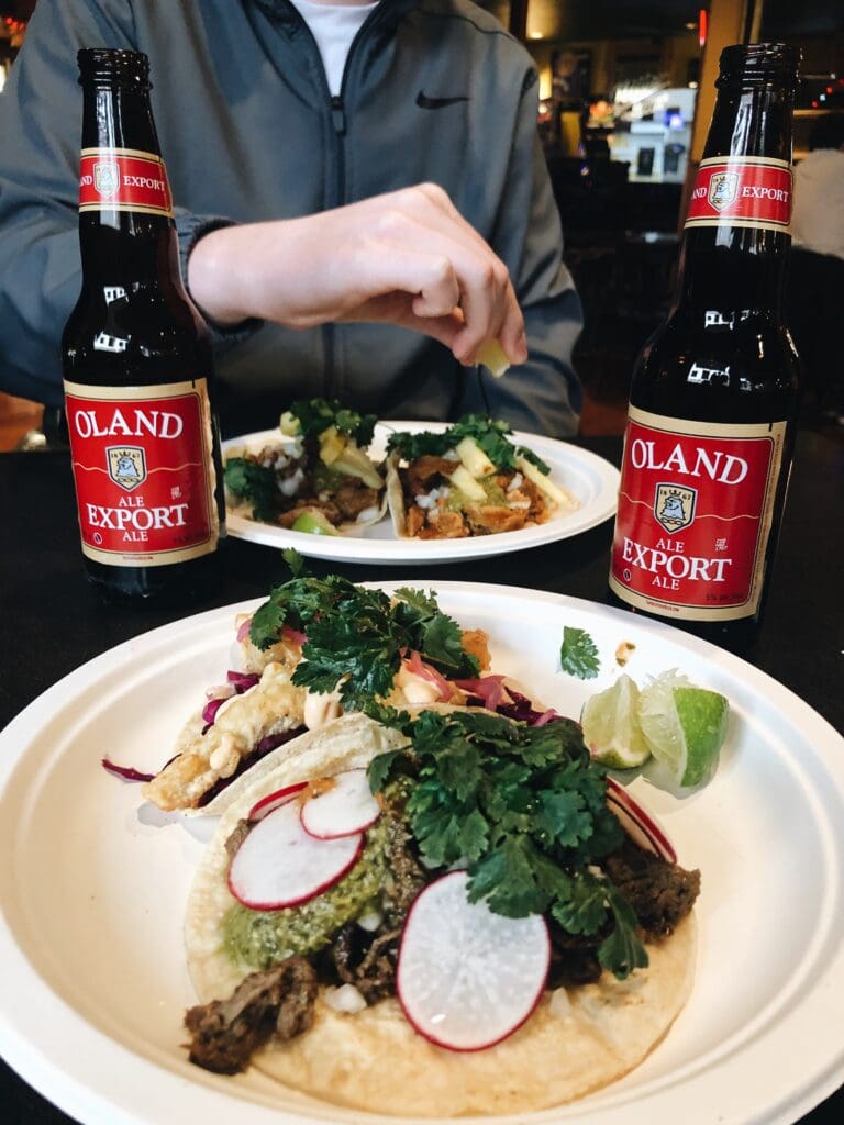 A meal of budget-friendly bites consisting on tacos and local beer.