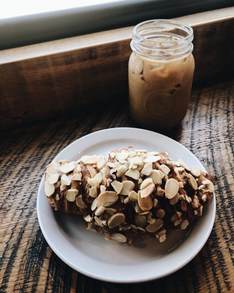 An almond croissant and iced latte from Two If By Sea in Dartmouth, Nova Scotia.