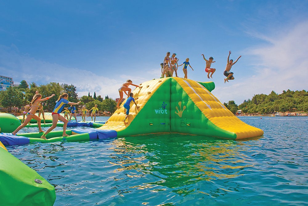 Kids jumping off the Sylvan Lake Aqua Splash