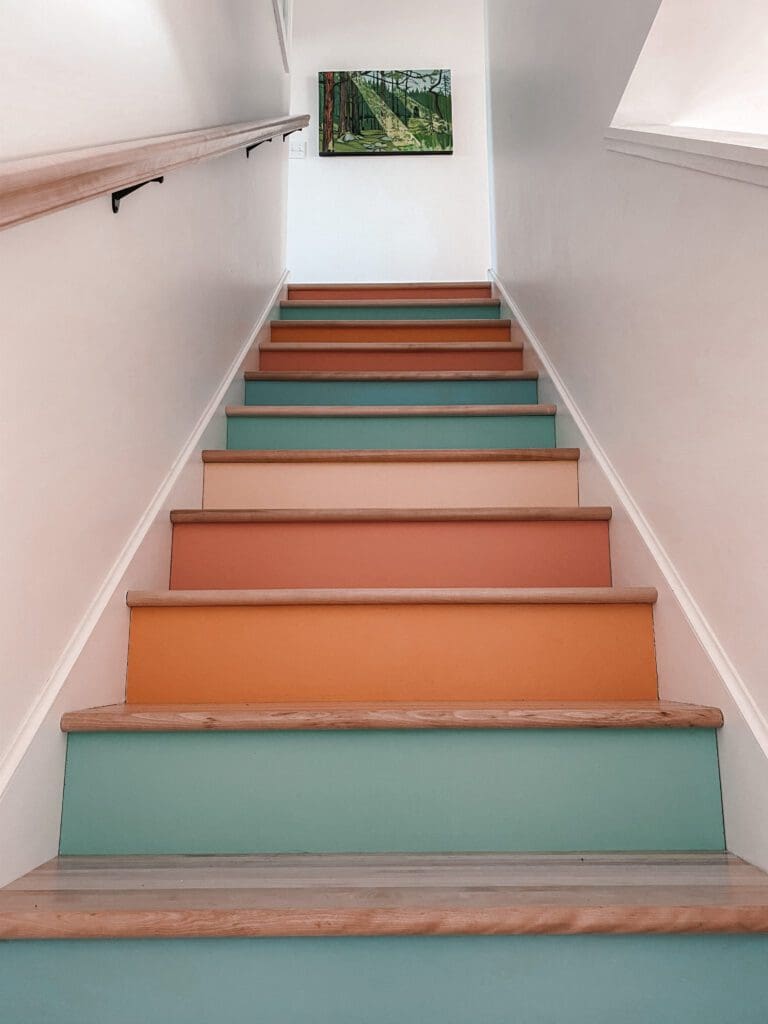 A colourful staircase located in the main house at this luxury staycation.