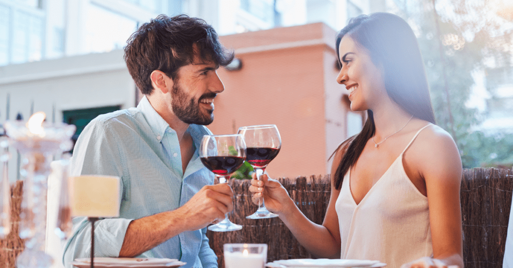 romantic dinner couple toasting with wine classes