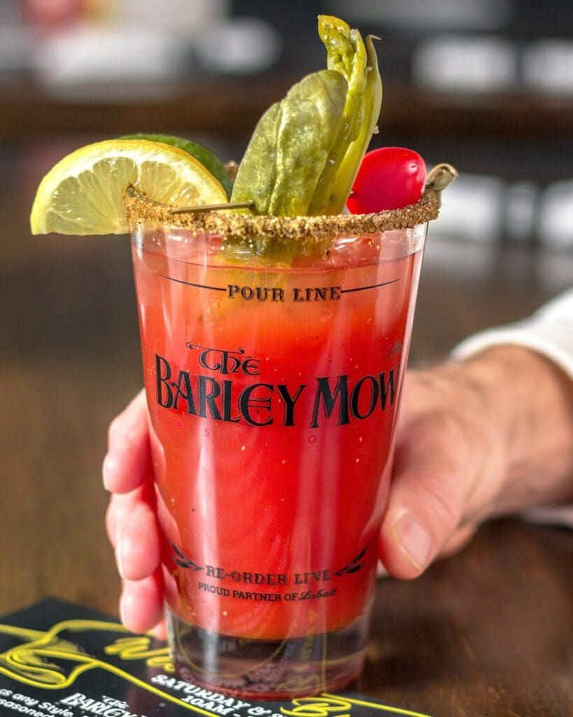 A hand holding a caesar from The Barley Mow.