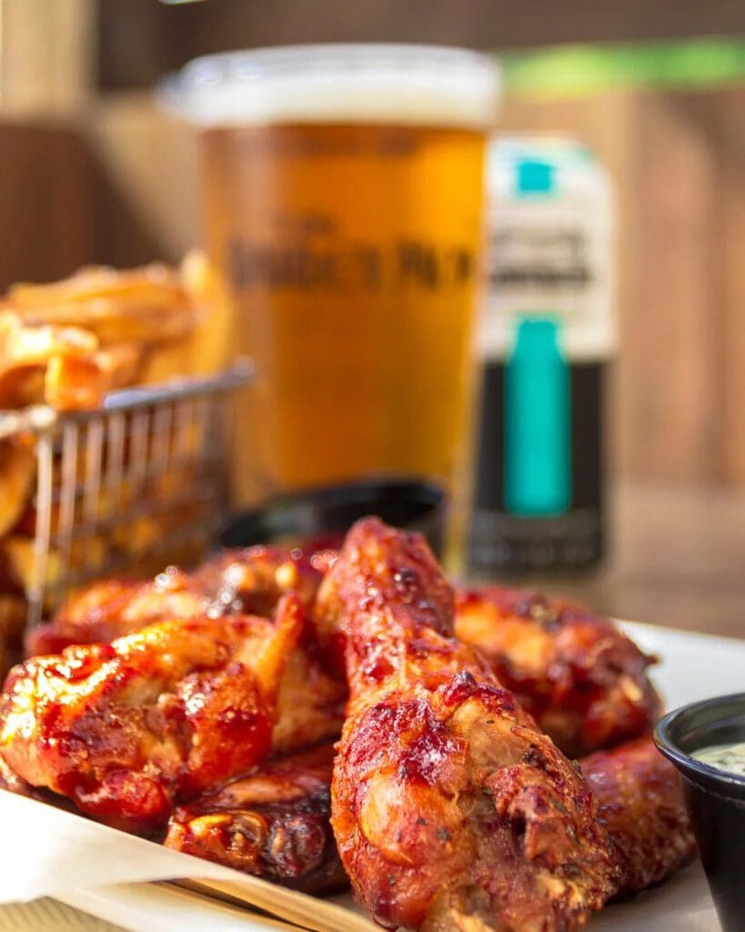 Delicious pub food and drinks, including chicken wings and beer, from The Barley Mow.