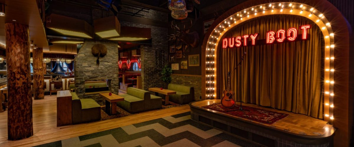 DUSTY-BOOT-INTERIOR-2026-APRIL-STAGE-DANCE-FLOOR-COUCH-AREA-MOODY