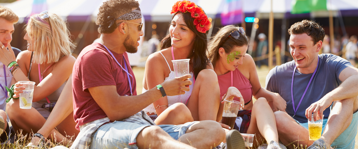 couples sitting on the grass